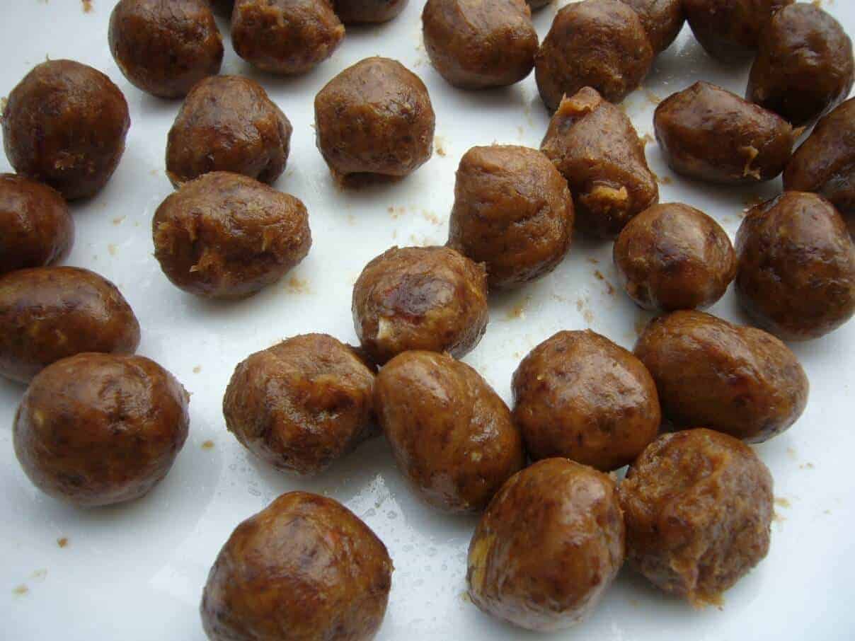 Maamoul cookies preparation. Rolling the date paste into balls.