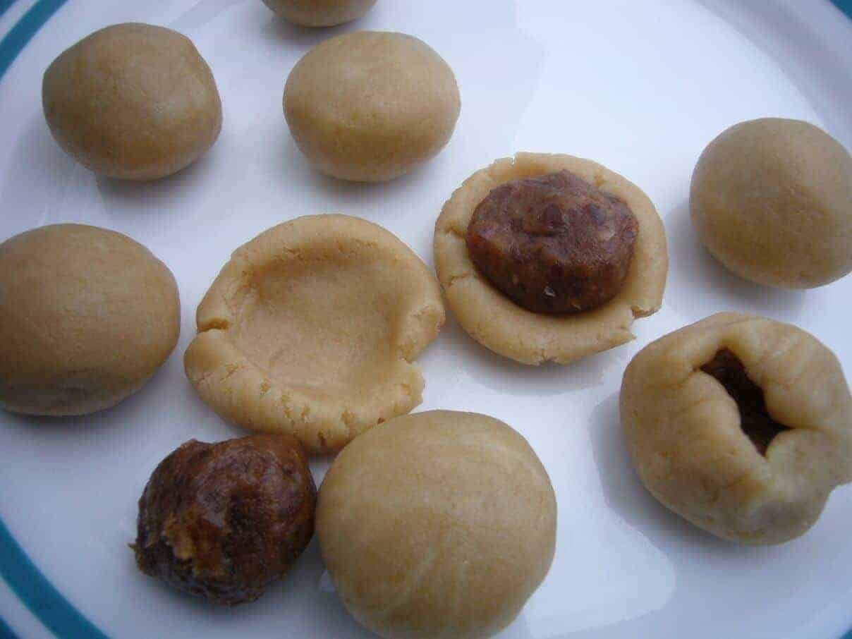 Maamoul (date filled) cookies preparation. Making the cookies with the date filling.