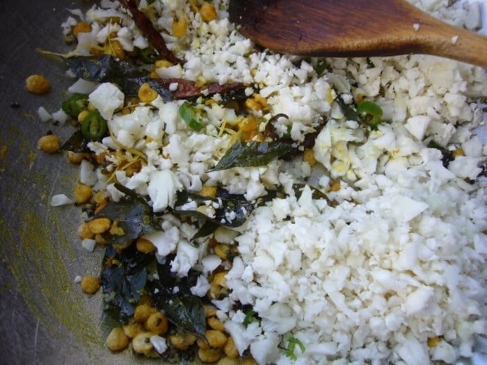 Indian Style Cauliflower Lemon Rice. Add the riced cauliflower to the seasoning.