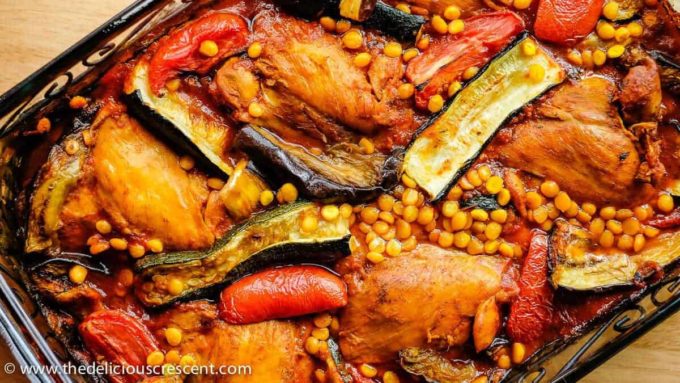 Close view of chicken zucchini stew with tomatoes and split peas.