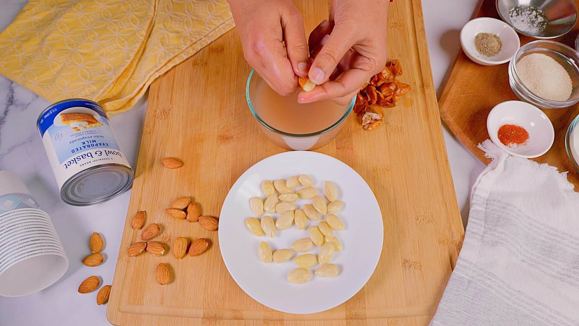 Peeling raw almonds.