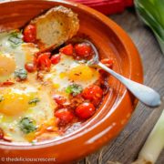 Moroccan eggs in tomato sauce (shakshuka) served in a tagine.