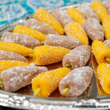 Mulberry marzipan candy (Toot) arranged on a plate.