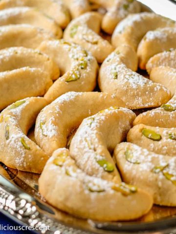 German vanilla crescent cookies also known as vanillekipferl, served on a plate.