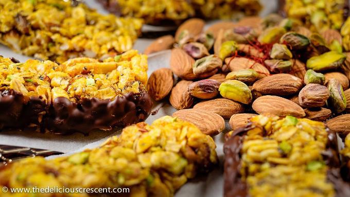 Saffron strands scattered on almonds and granola bars.