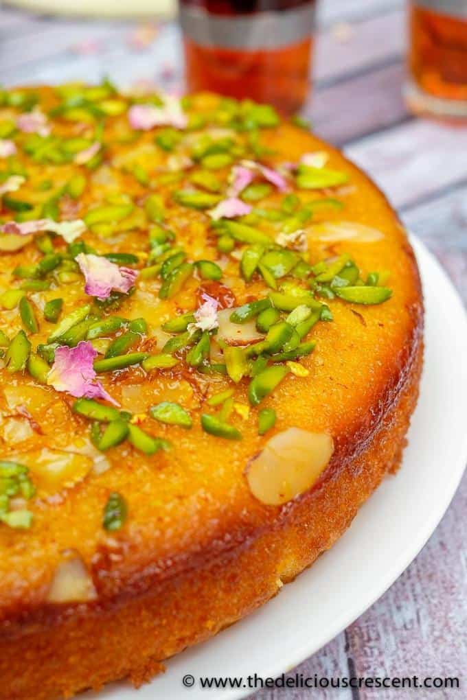 Persian love cake served on a white plate.