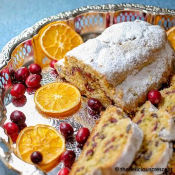 Cranberry orange quark stollen served on a platter.