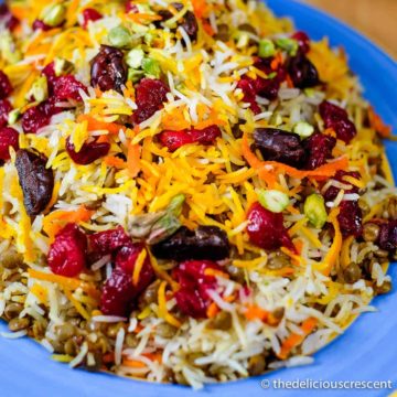 Lentils and rice with cranberries served on a plate.