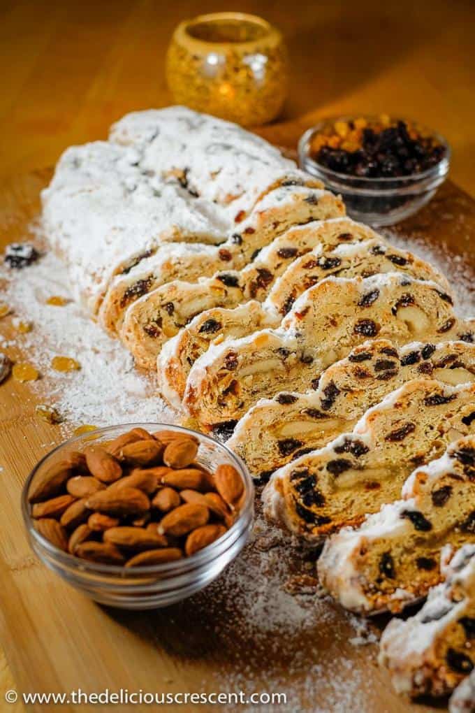 A German stollen sliced and placed on a table.