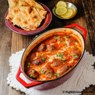 Meatball curry (kofta curry) served in a cast iron dish.