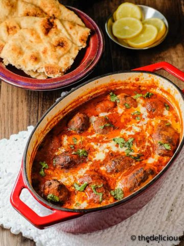 Meatball curry (kofta curry) served in a cast iron dish.