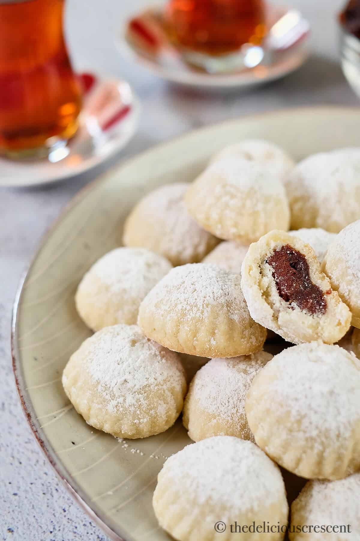 Front view of date shortbread cookies in a grey plate.