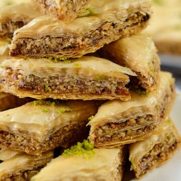 Close view of Persian style baklava served on a white plate.