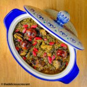 Ghormeh sabzi (Persian Herb Stew) served in a blue dish.