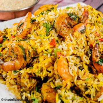 Persian shrimp and rice served on a white plate.