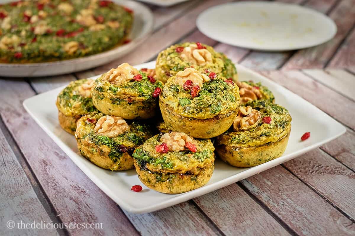 A stack of kuku sabzi in muffin style.