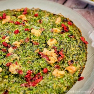 Kuku Sabzi (Persian Herb Frittata) served on a plate.