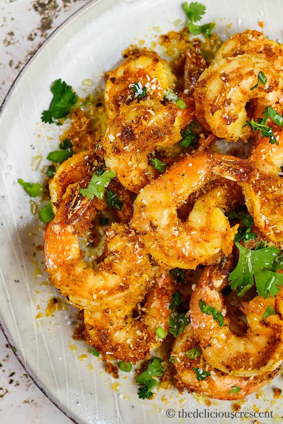 Close up view of masala shrimp fry in a plate.