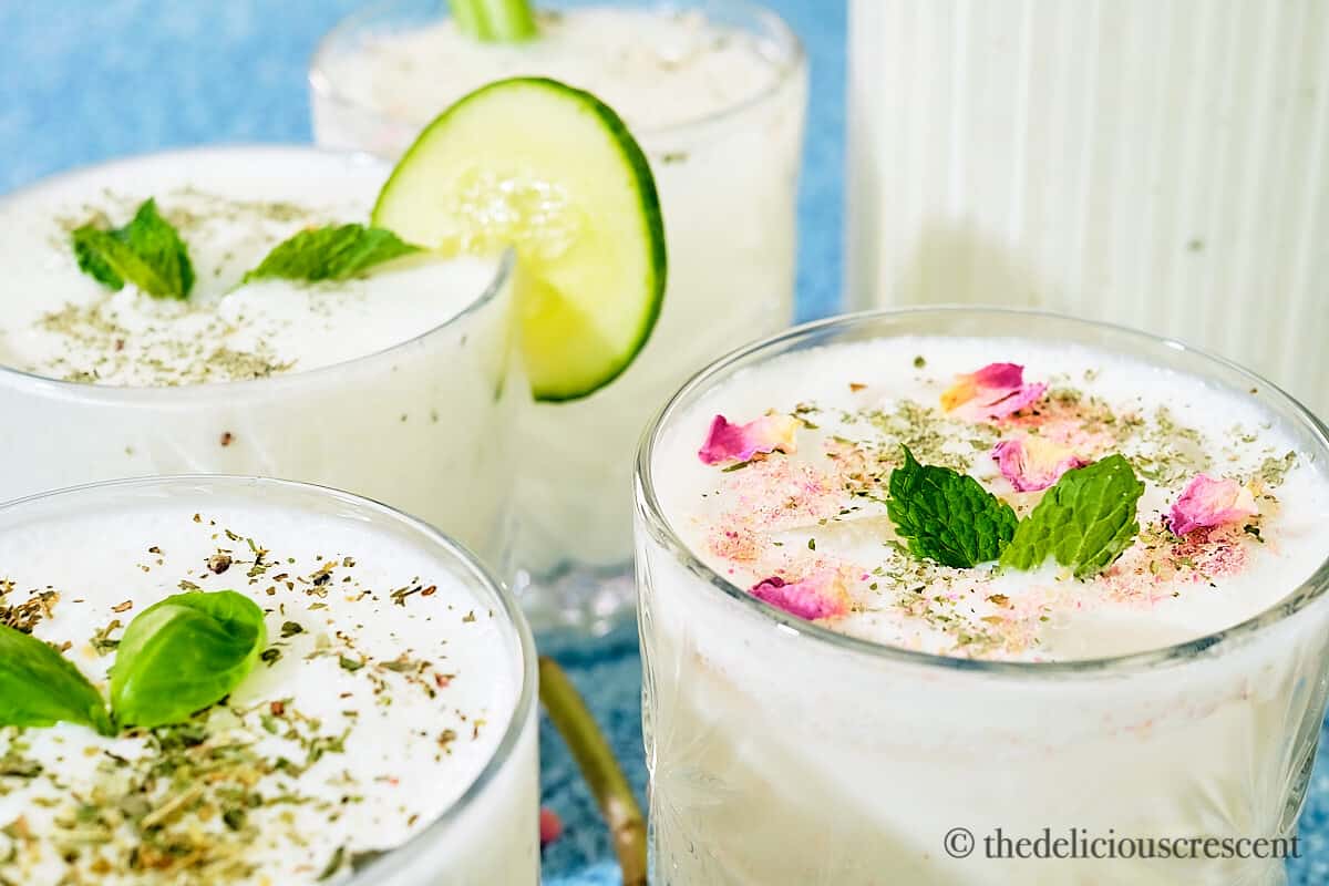 Close up view of Doogh yogurt drink filled in glasses.