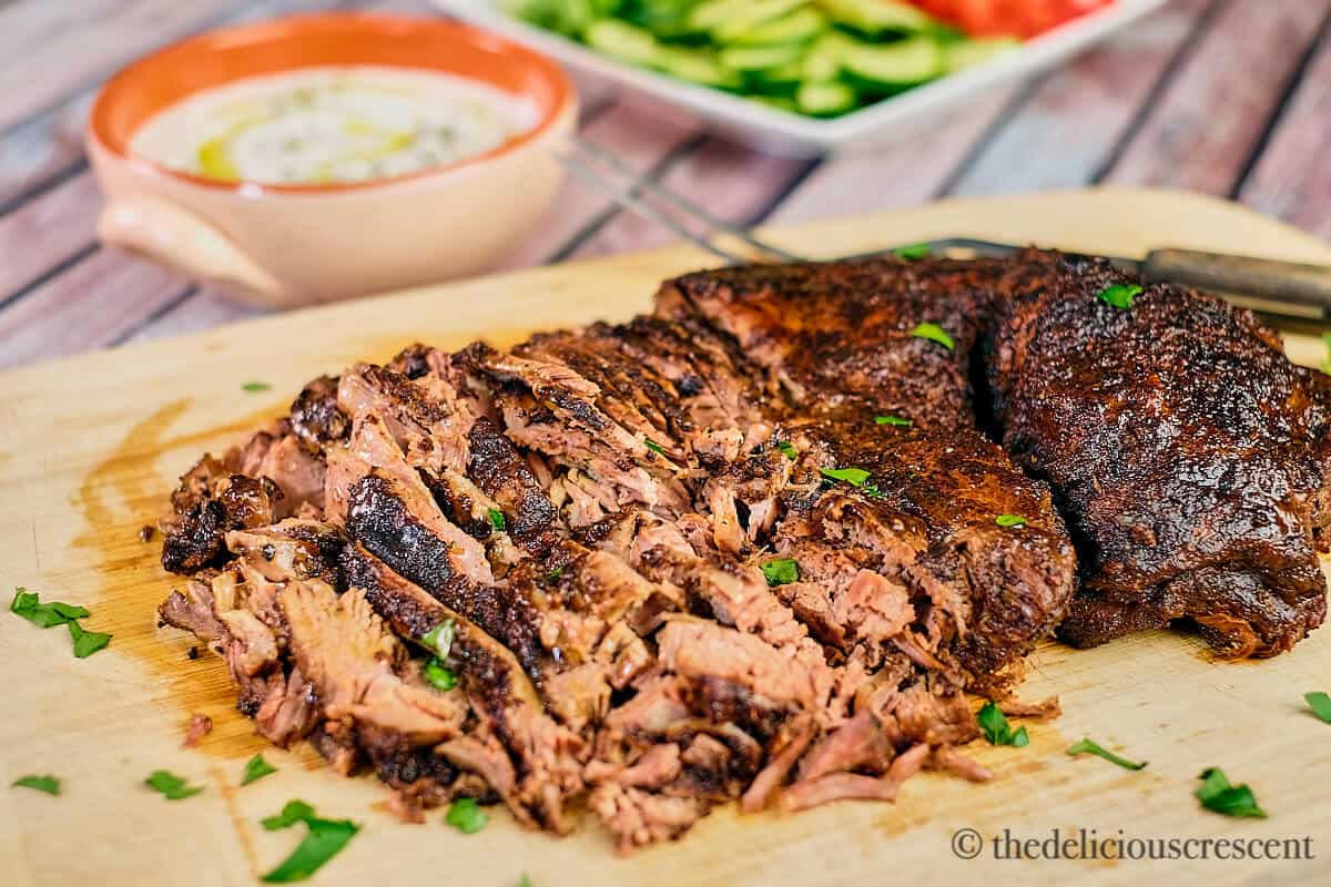 Front view of roast lamb spiced with middle eastern spices.