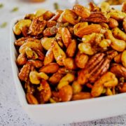 A bowl of sweet and savory roasted party nuts.