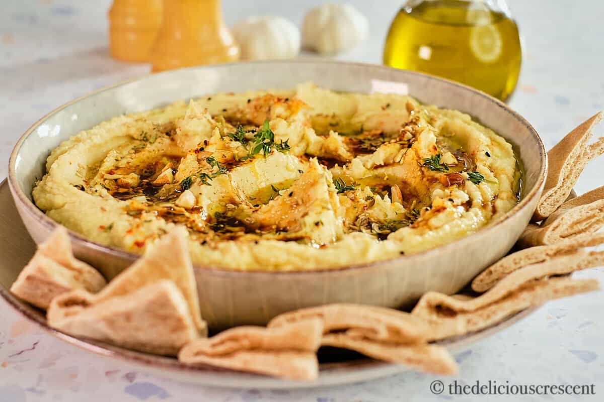 Mashed lima beans topped with dukkah and olive oil served with pita bread.