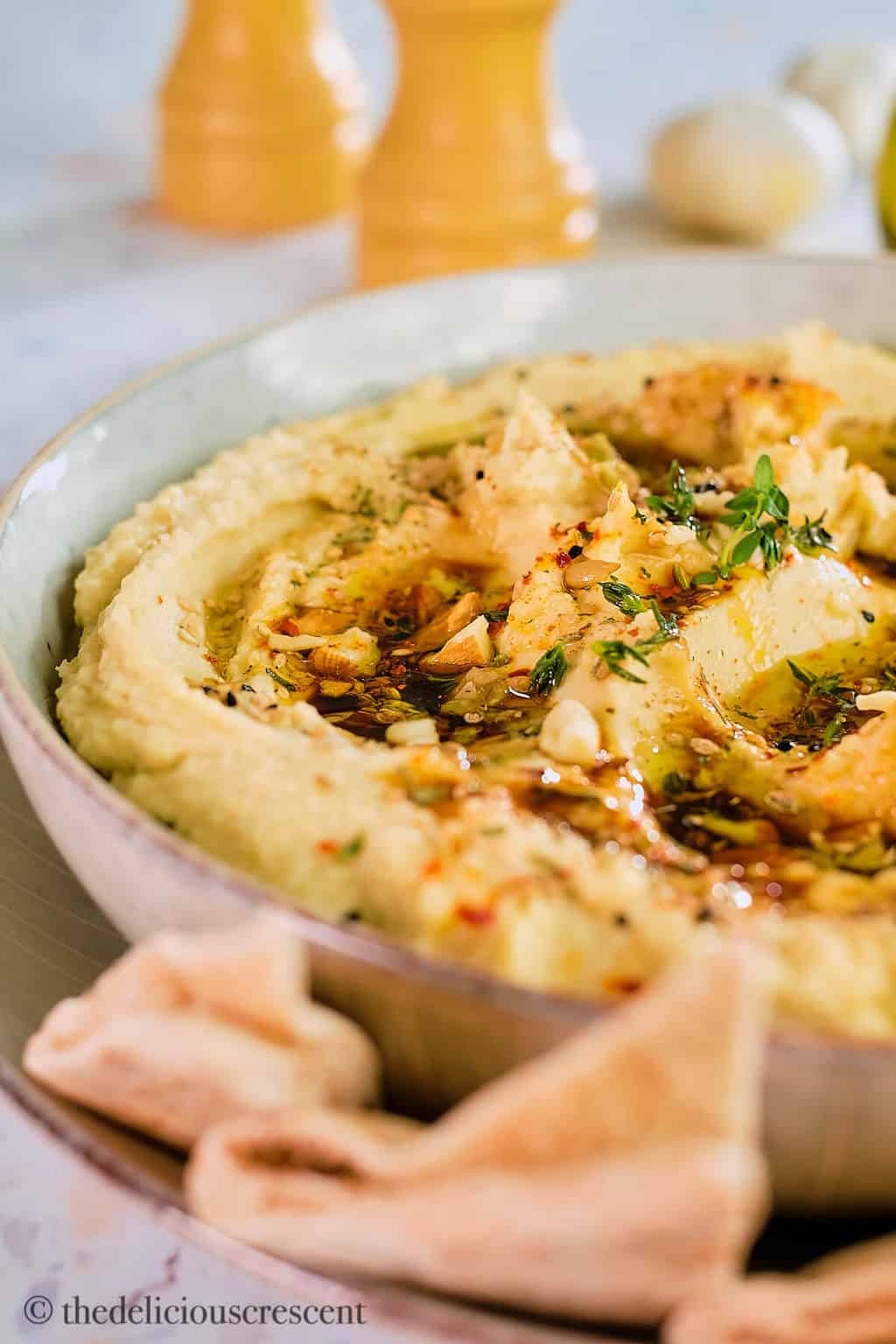 Close up view of butter bean dip in a bowl.