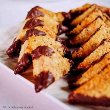 Nussecken, the German chocolate hazelnut bar cookies served on a plate.