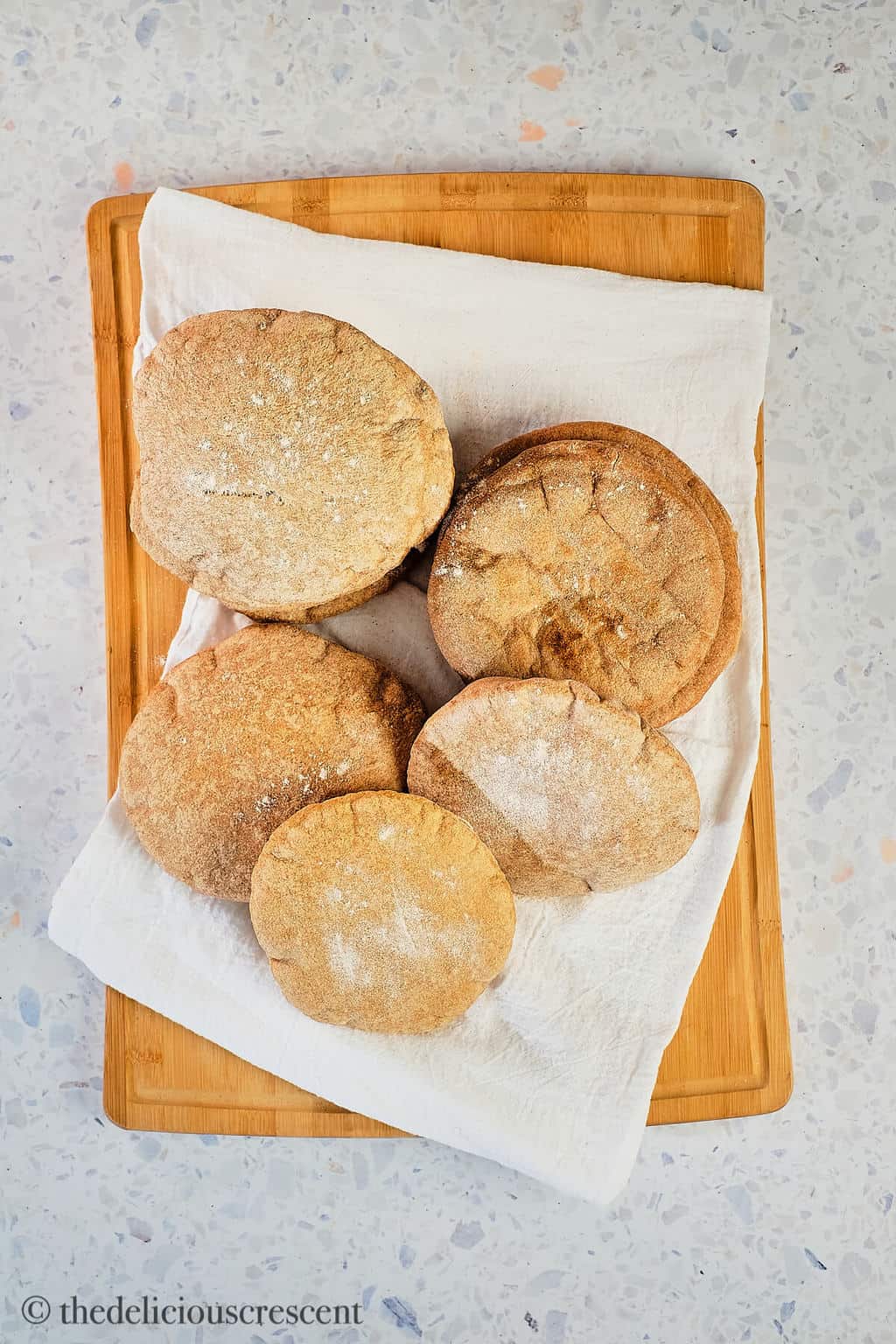 Overhead view of some middle eastern puffy pocket breads.