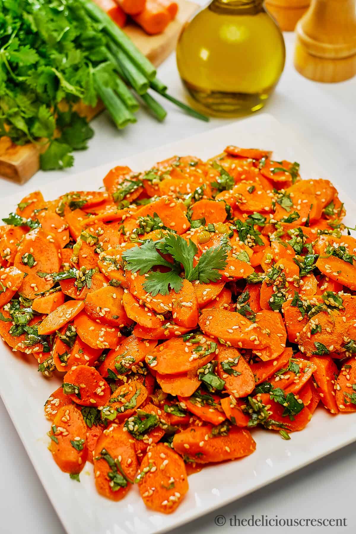 Moroccan carrot salad served in a white plate.