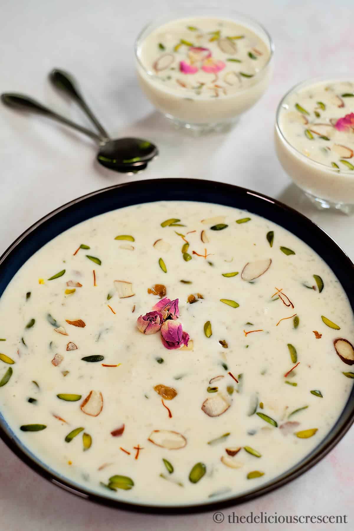 A bowl of rice kheer placed on a table.