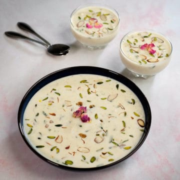 Rice kheer served in a large bowl and two small bowls.