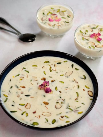Rice kheer served in a large bowl and two small bowls.