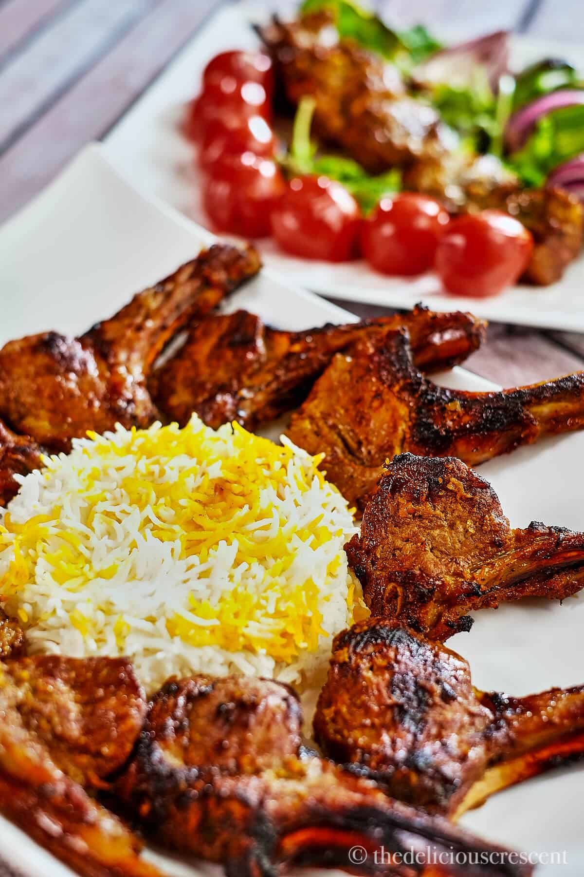 Grilled lamb chops served around saffron rice.