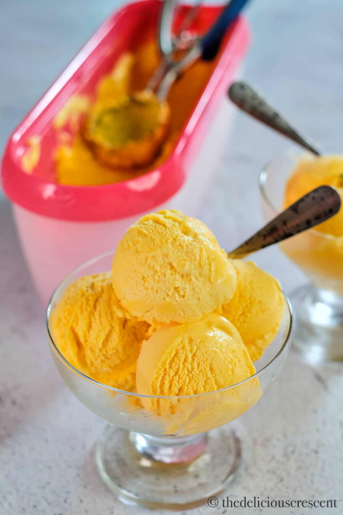 Creamy gelato made with mango and served in a bowl.