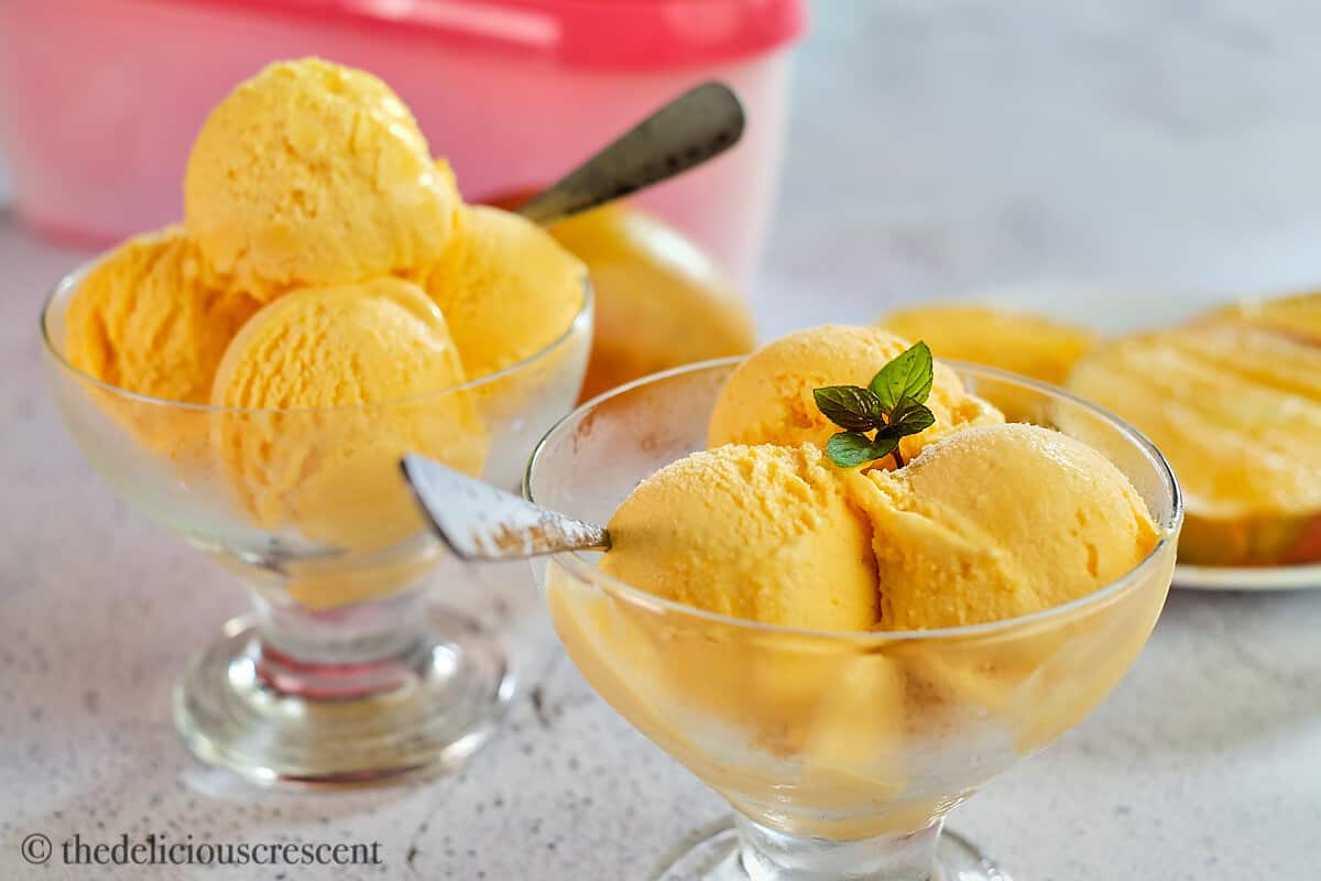 Fresh and creamy Italian mango ice cream in glass bowls.