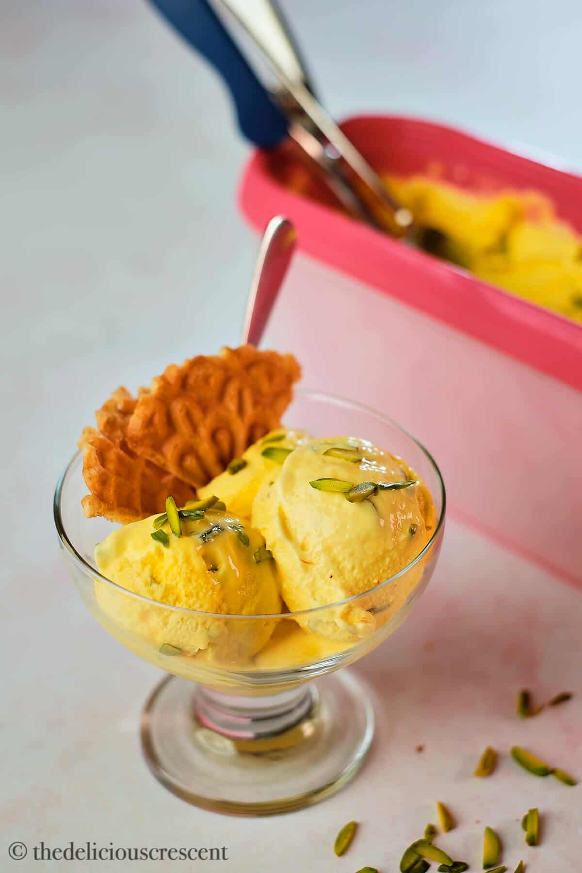 Scoops of Persian ice cream in a glass cup.