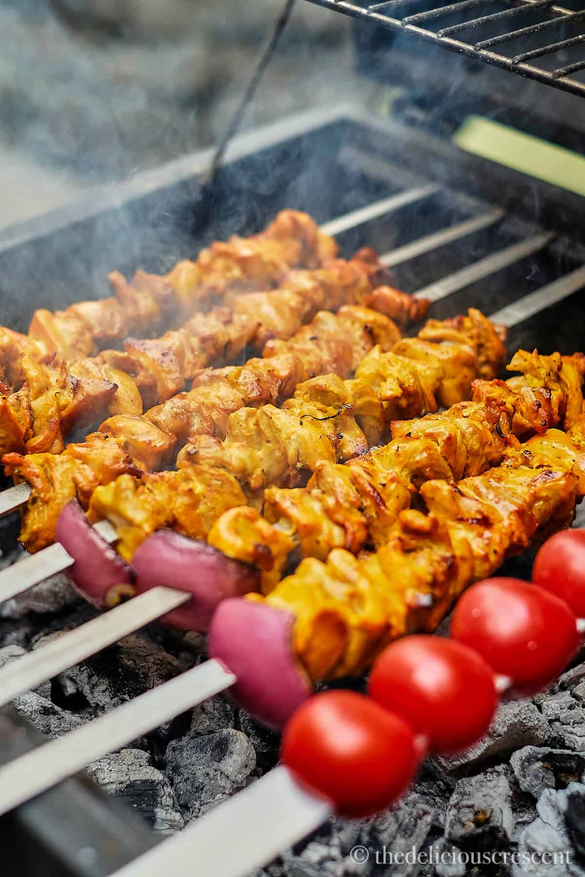 Persian grilled chicken kabobs on skewers.