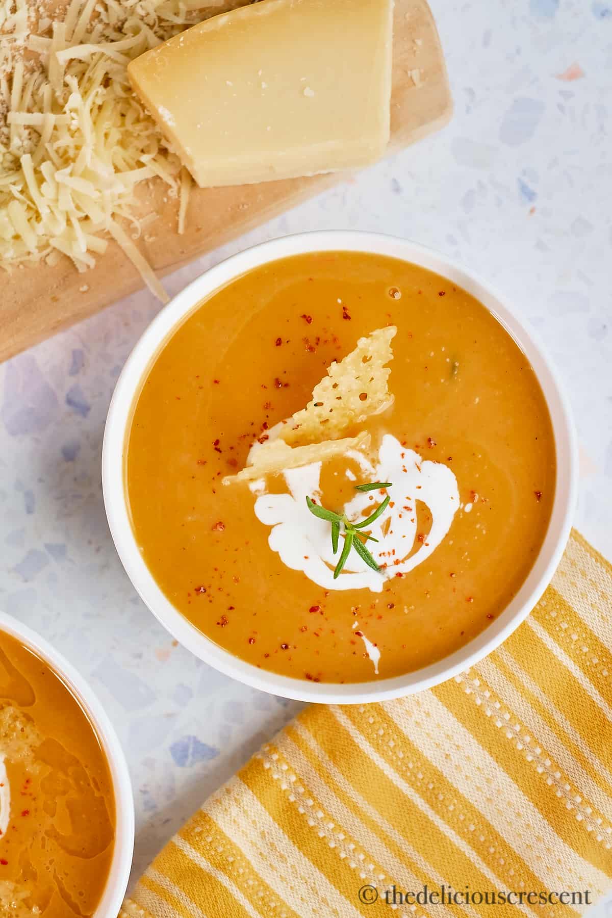 A bowl of creamy roasted sweet potato soup with coconut milk.