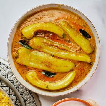 Close up view of mirchi ka salan served in a dish.