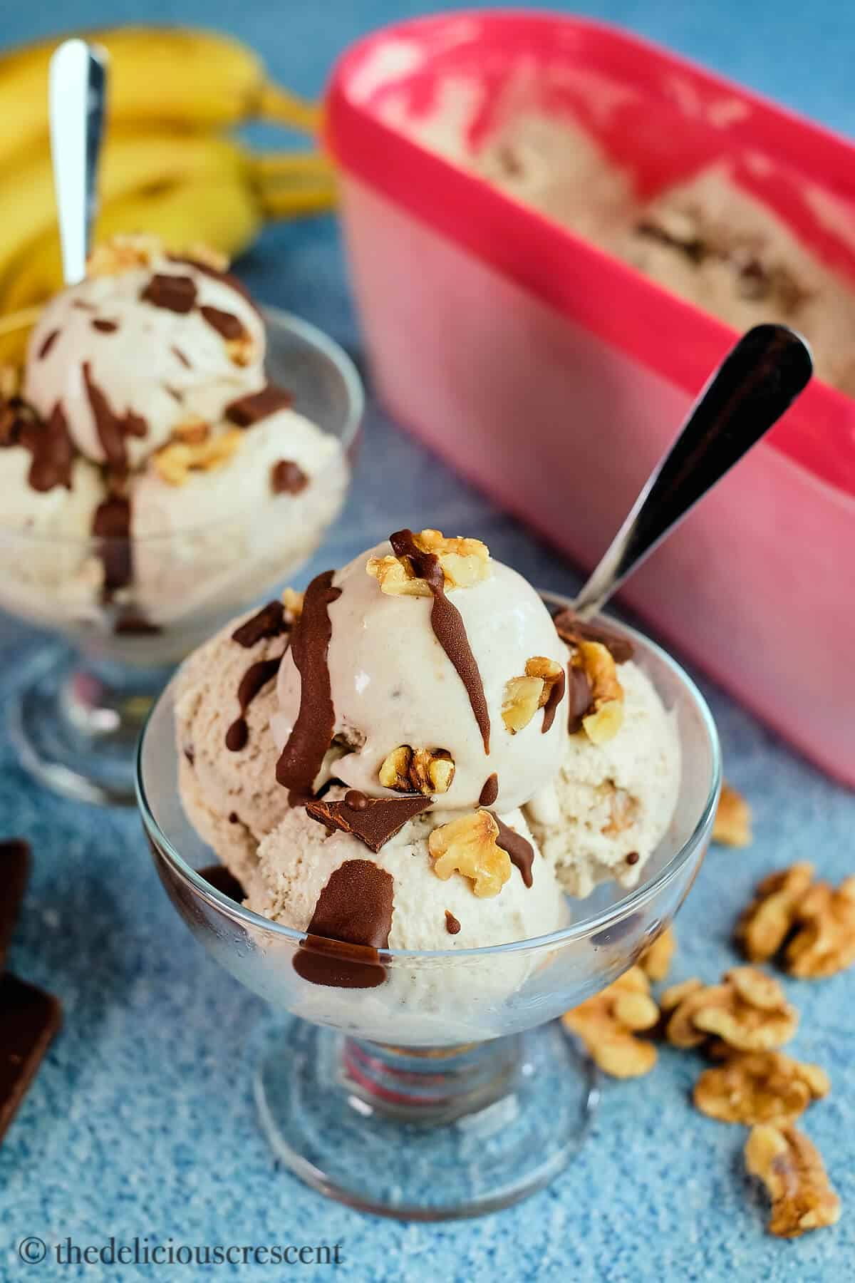 Scoops of banana nut ice cream in a cup.