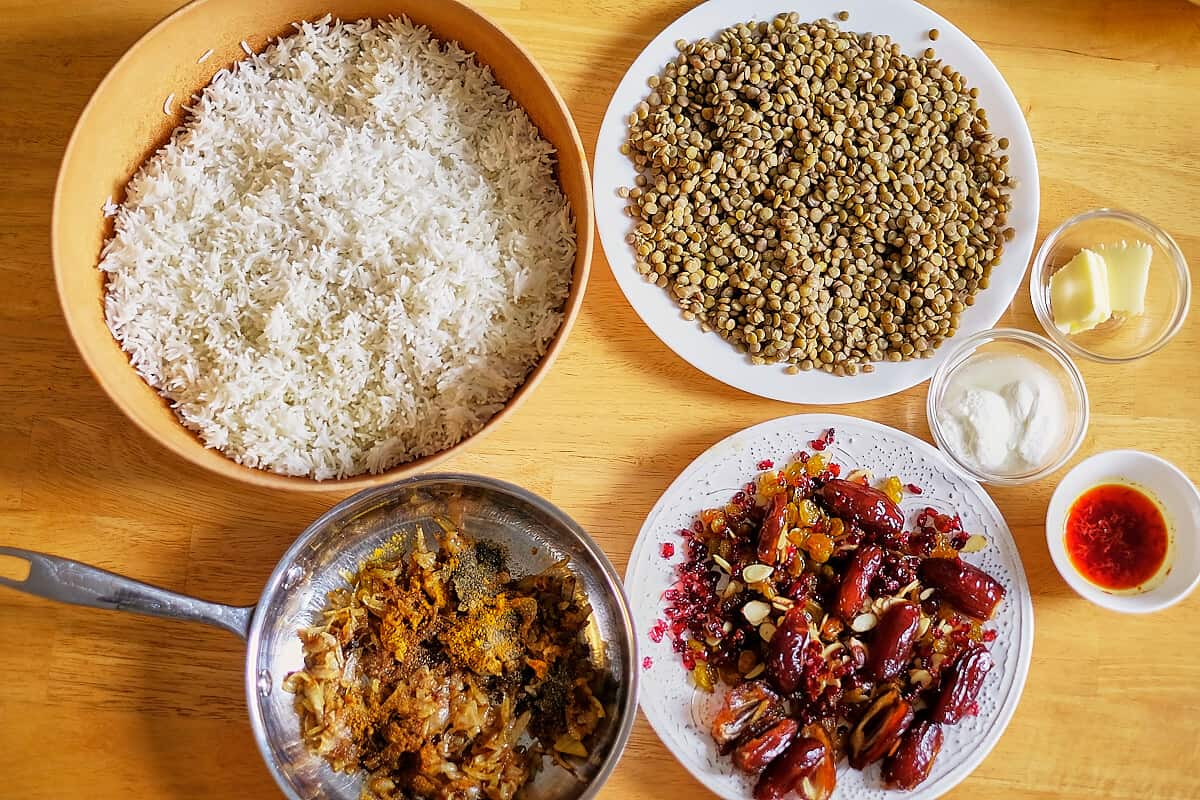 Cooke rice, lentils, sauteed onions on table.