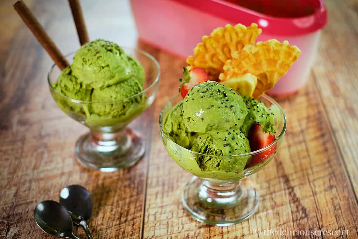 Green tea ice cream served in bowls.