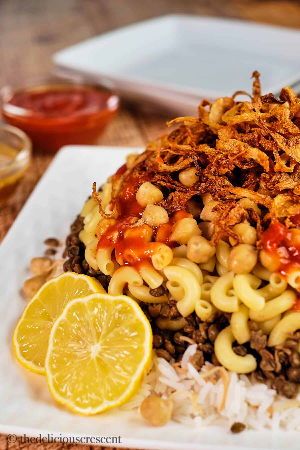 Koshari nicely plated and served on a table.