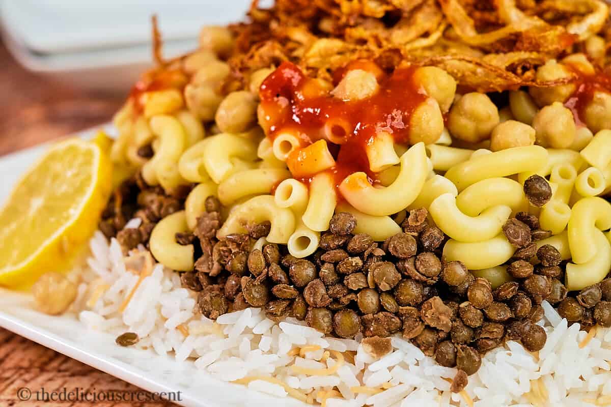 Layers of rice, lentils, pasta, chickpeas, fried onions in Koshari.