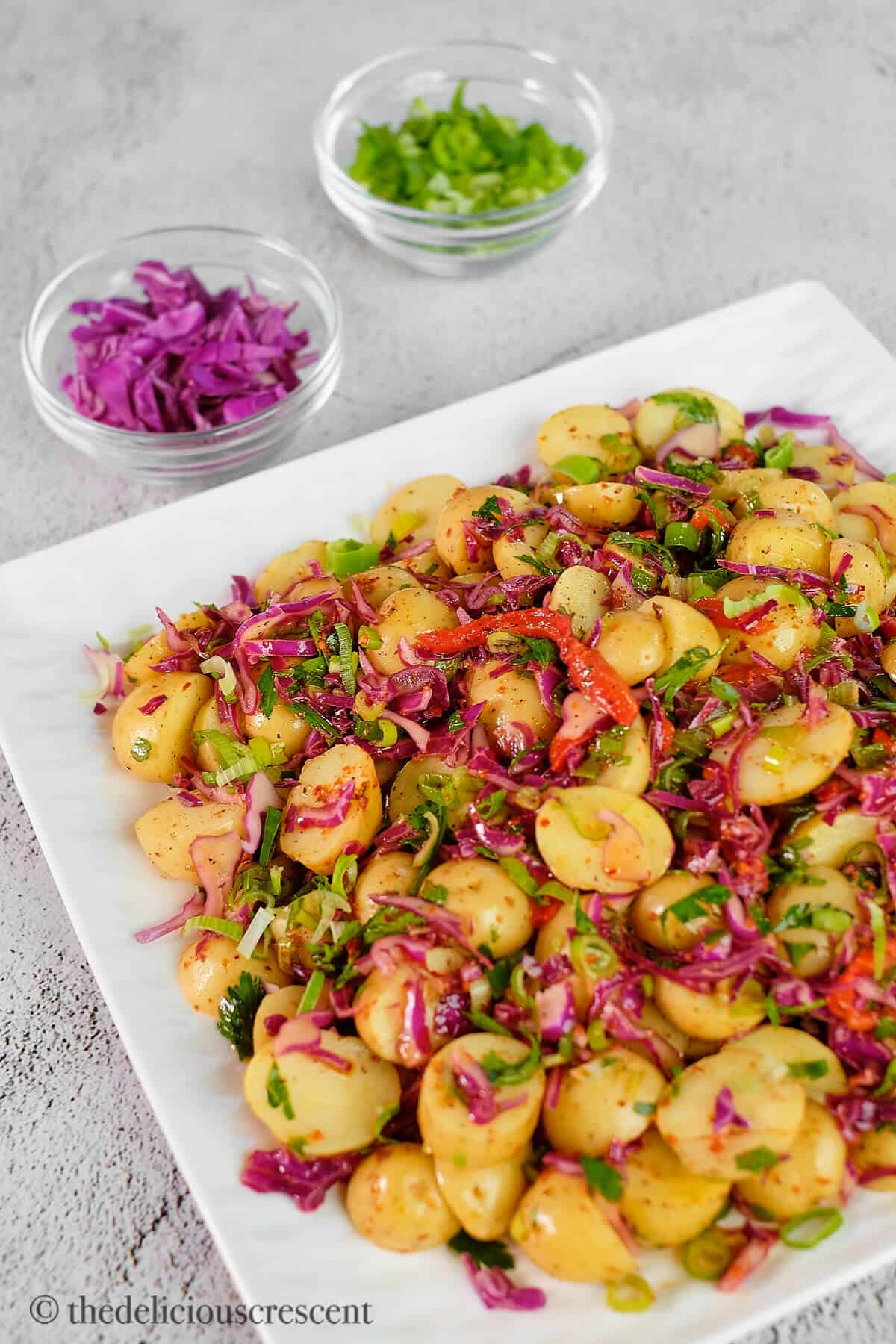 Warm Turkish potato salad served in a white plate.