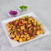 Close up view of salad made with baby potatoes, red cabbage, herb and mediterranean style dressing.