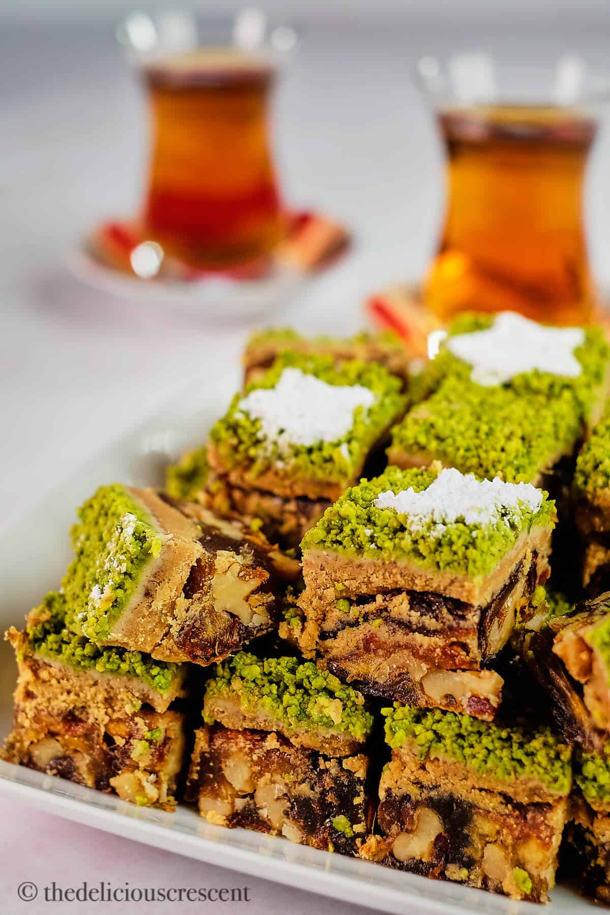 Persian date dessert stuffed with walnuts and cut into squares.