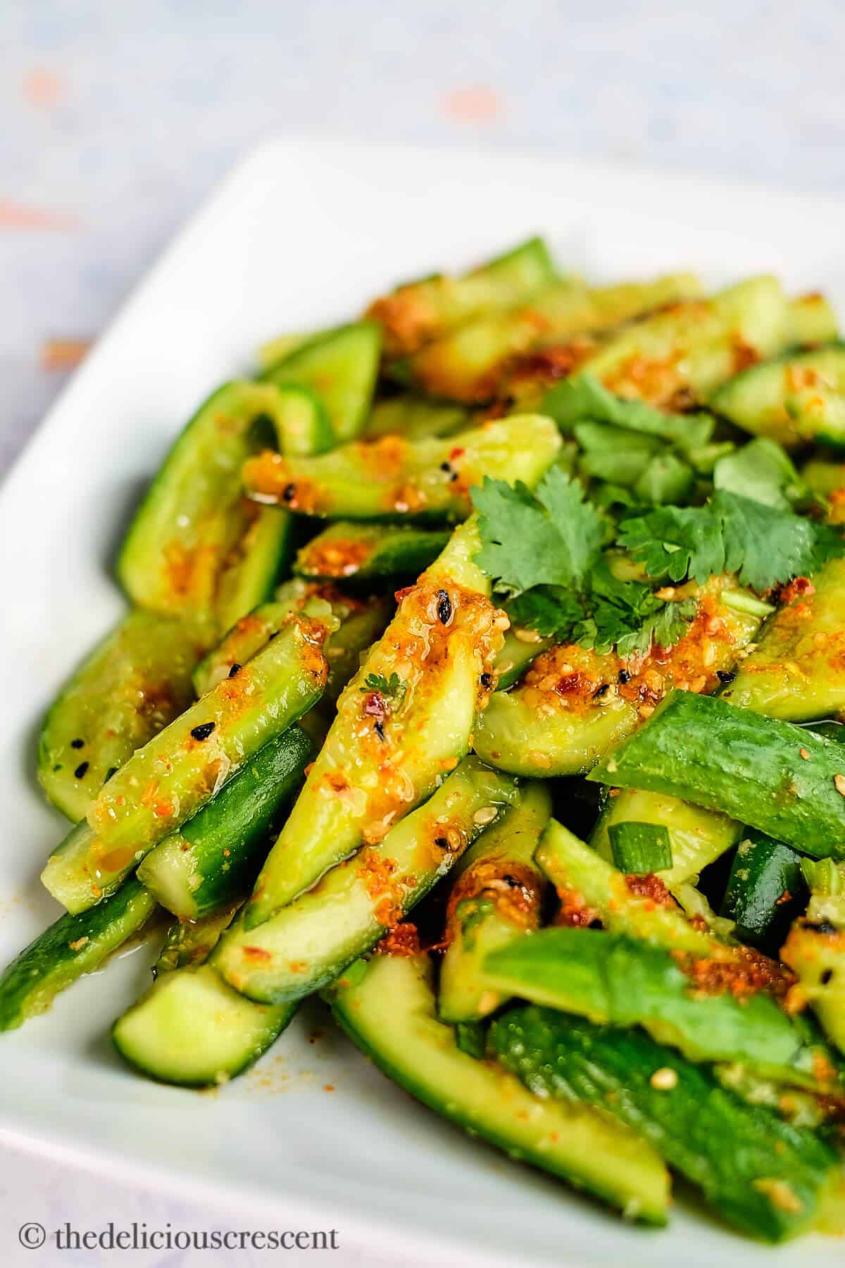 Pickled cucumber salad prepared in a smashed style with Asian spices.