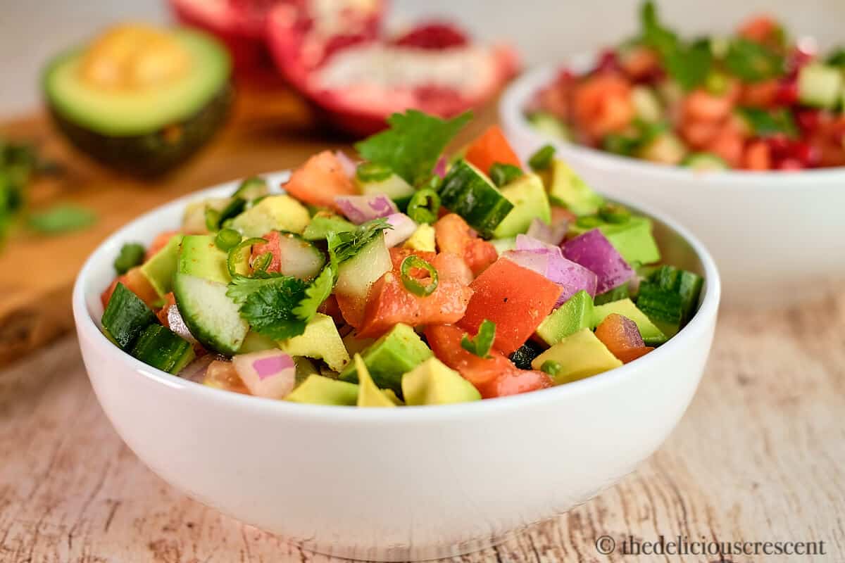 Cucumber tomato salad in a bowl.